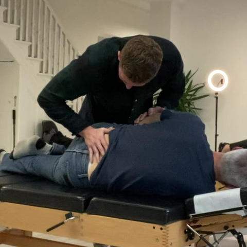 Chiro adjusting man