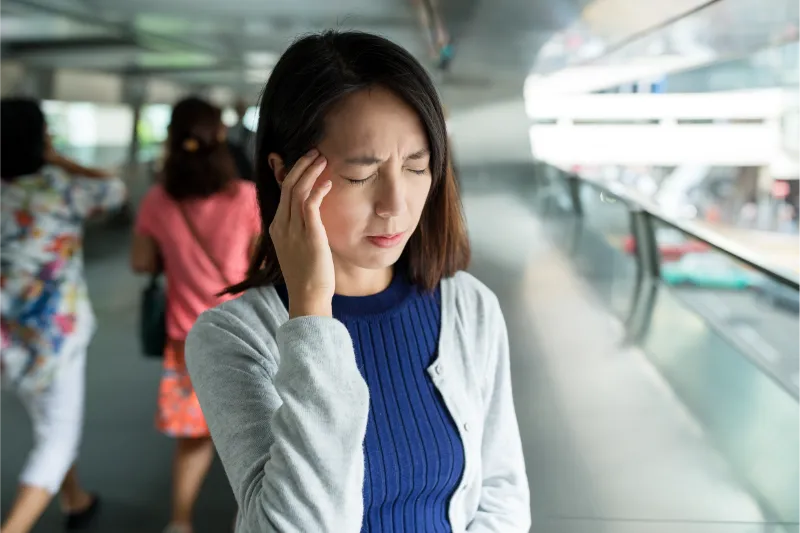 woman feeling headache in the foot bridge 2023 11 27 04 51 16 utc